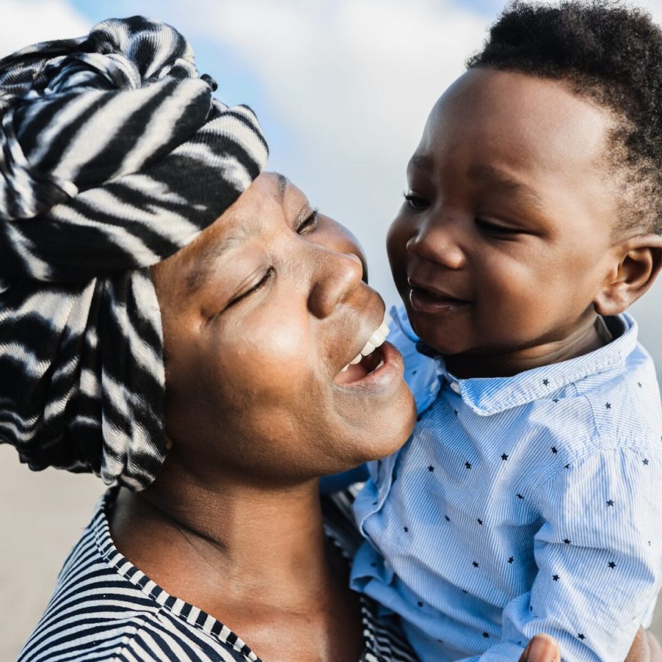 African mother having tender moment with little son